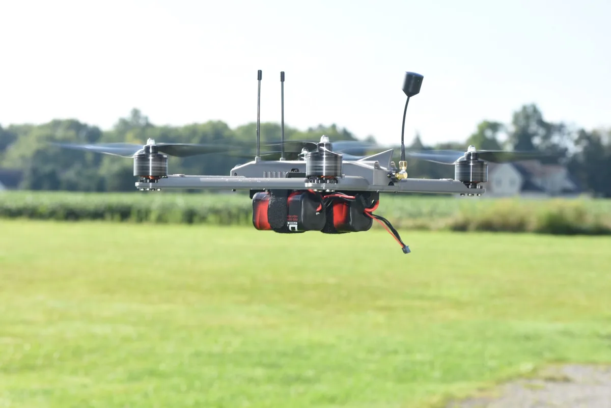 Remora drone hovering above a field